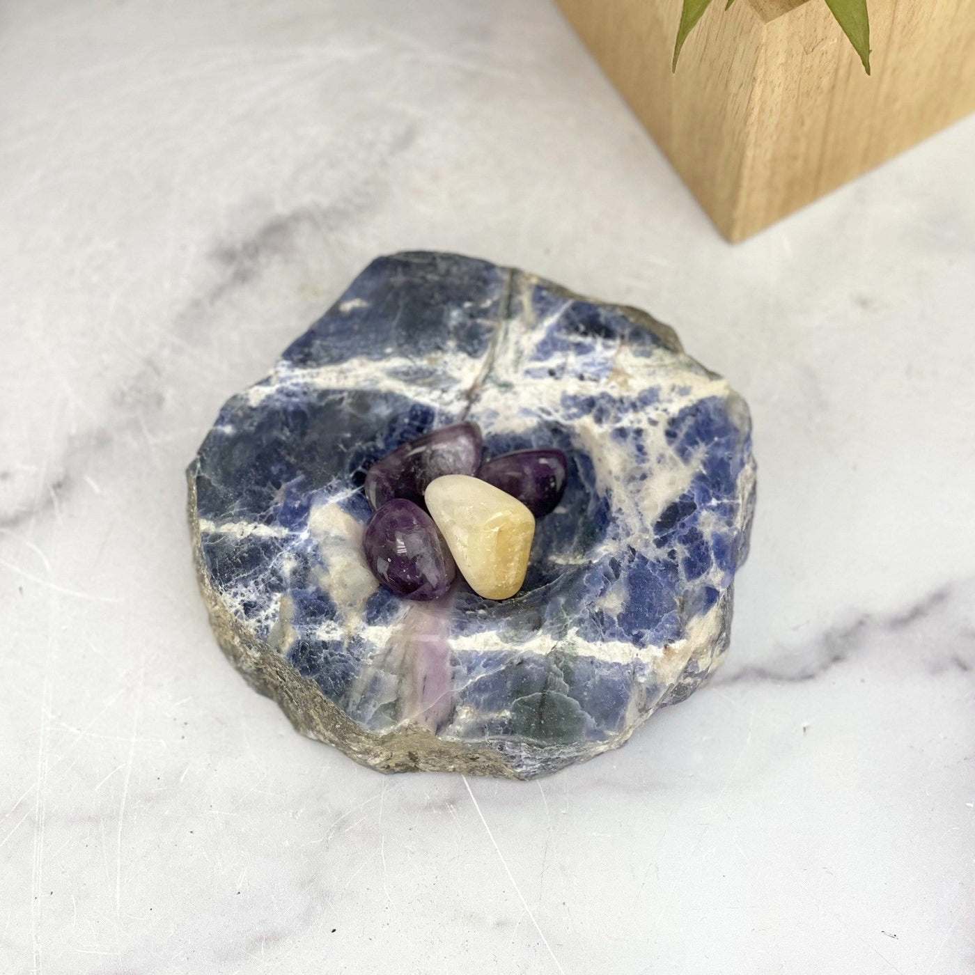 overhead view of sodalite polished soap dish with stones inside for size reference