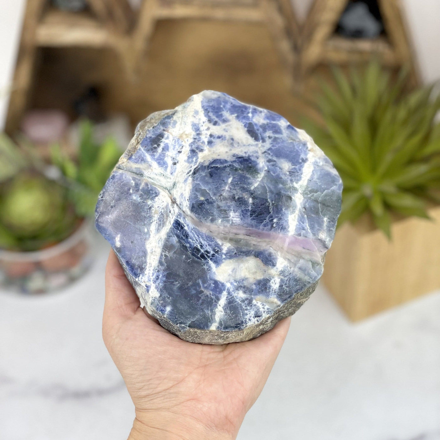 sodalite polished soap dish in hand for size reference