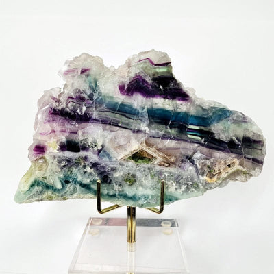 close up of the details in the AA grade fluorite slab. showing the purples, greens, teals, white and blues.