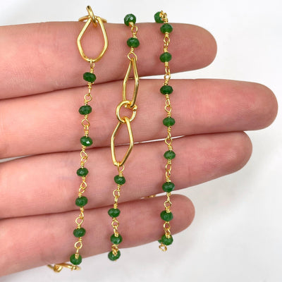 close up of green onyx beaded chain necklace wrapped three times around hand for chain details
