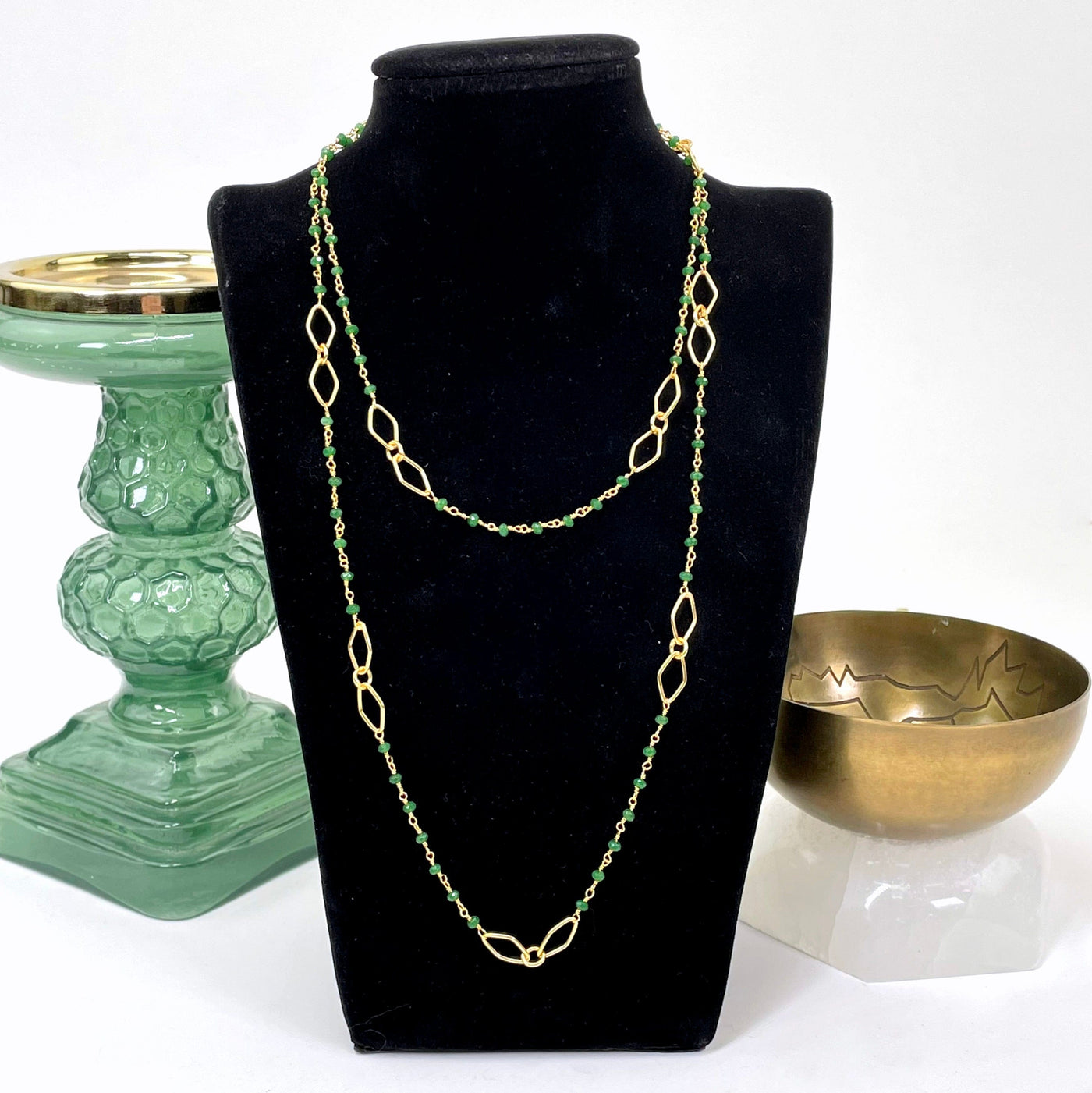 full green onyx beaded chain necklace length wrapped twice around a bust display