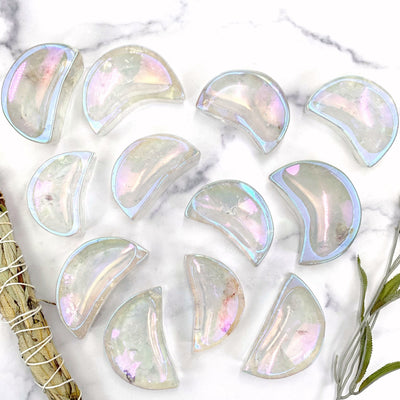 12 angel aura moon bowls on a white marble background