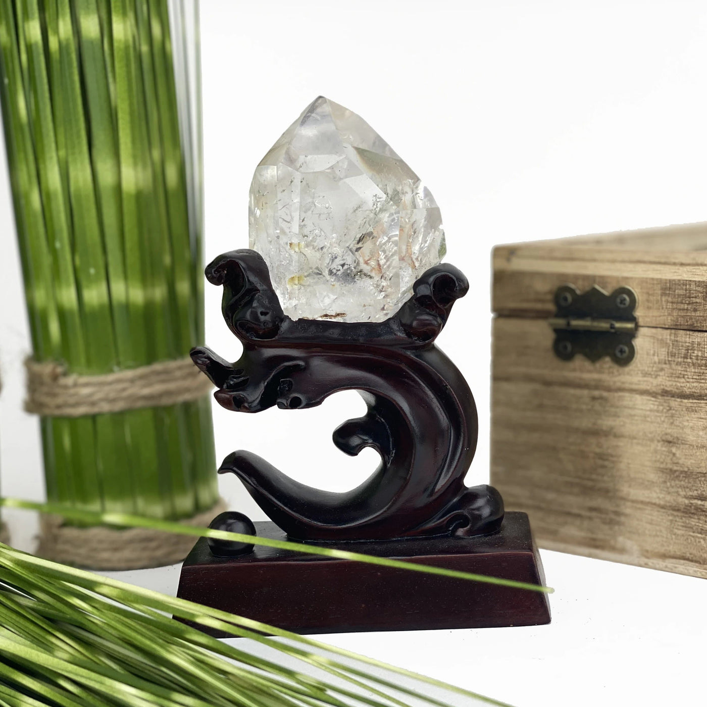 Lodolite Crystal Quartz Enhydro on Wooden Stand.