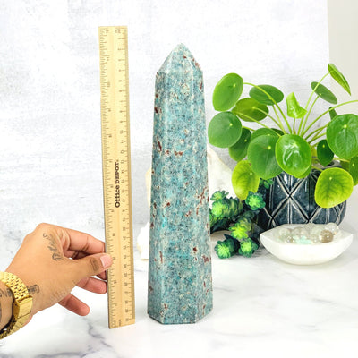 Ruler comparing height to the Amazonite Polished Point Tower