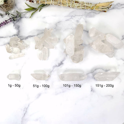 4 variations of lemurian quartz on marble background