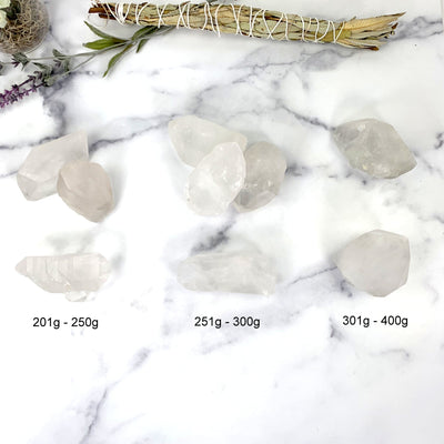 lemurian points next to their sizes. available in 201-250g, 251-300g and 301-400g
