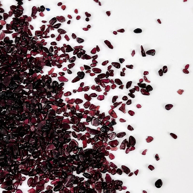 small garnet chips displayed on a white background 