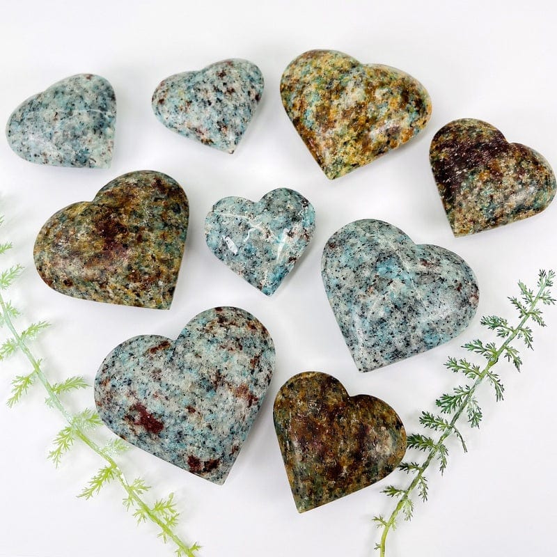 multiple amazonite polished hearts displayed showing the differences in sizes 