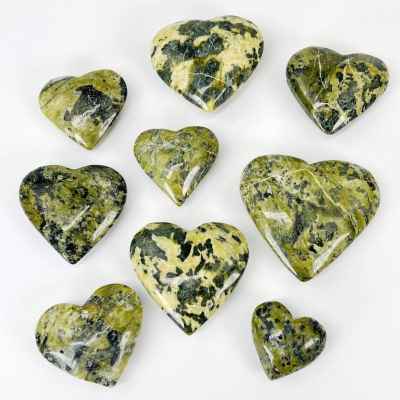 multiple jadeite hearts displayed to show the differences in the sizes available 