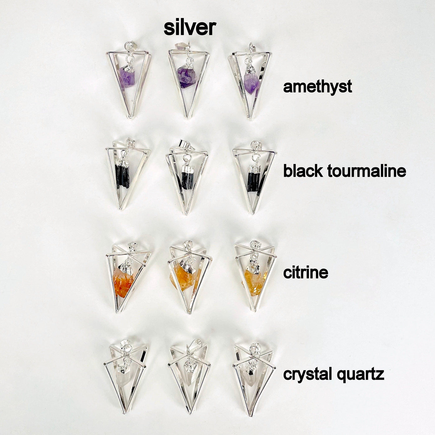 overhead view of all silver dangle stone point pendulum pendant options on white background for possible variations