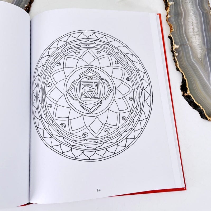 one page of the coloring book showing a chakra symbol that's ready to be colored 