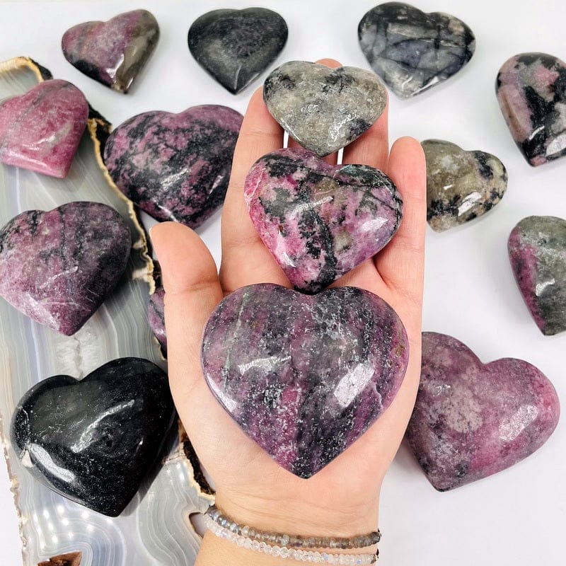 polished rhodonite stone shaped into hearts 