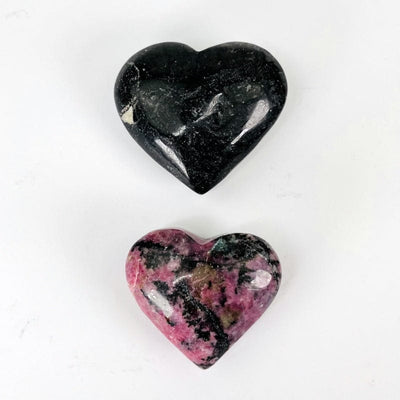 close up of polished rhodonite hearts