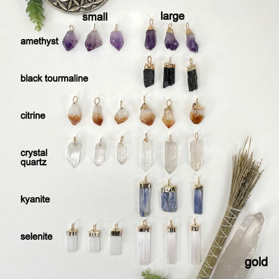 all gold hoop bail pendants on white background with small gemstone point pendants on the left and large gemstone point pendants on the right for size comparison