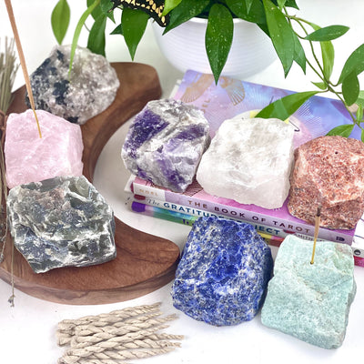 8 Rough Stone Incense Burners with plants and books around them