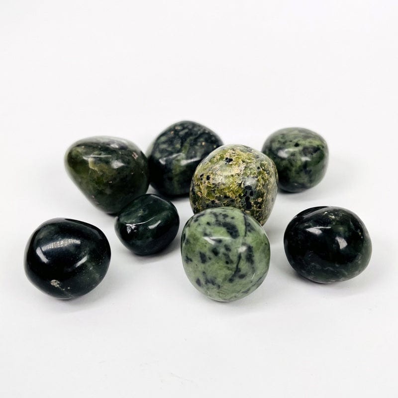 side view of the nephrite tumbled stones to show the thickness 