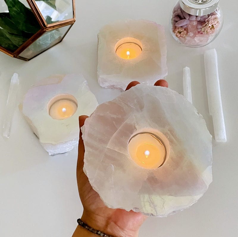 angel aura rose quartz candle holder in hand for size reference 