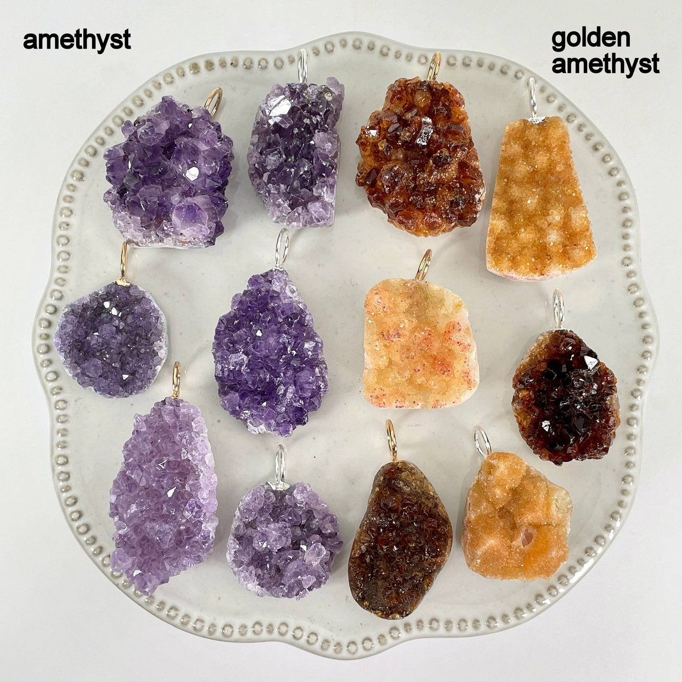 overhead view of many amethyst druzy cluster pendant options on display for possible variations