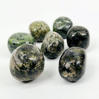 side view of the nephrite tumbled stones to show the thickness 