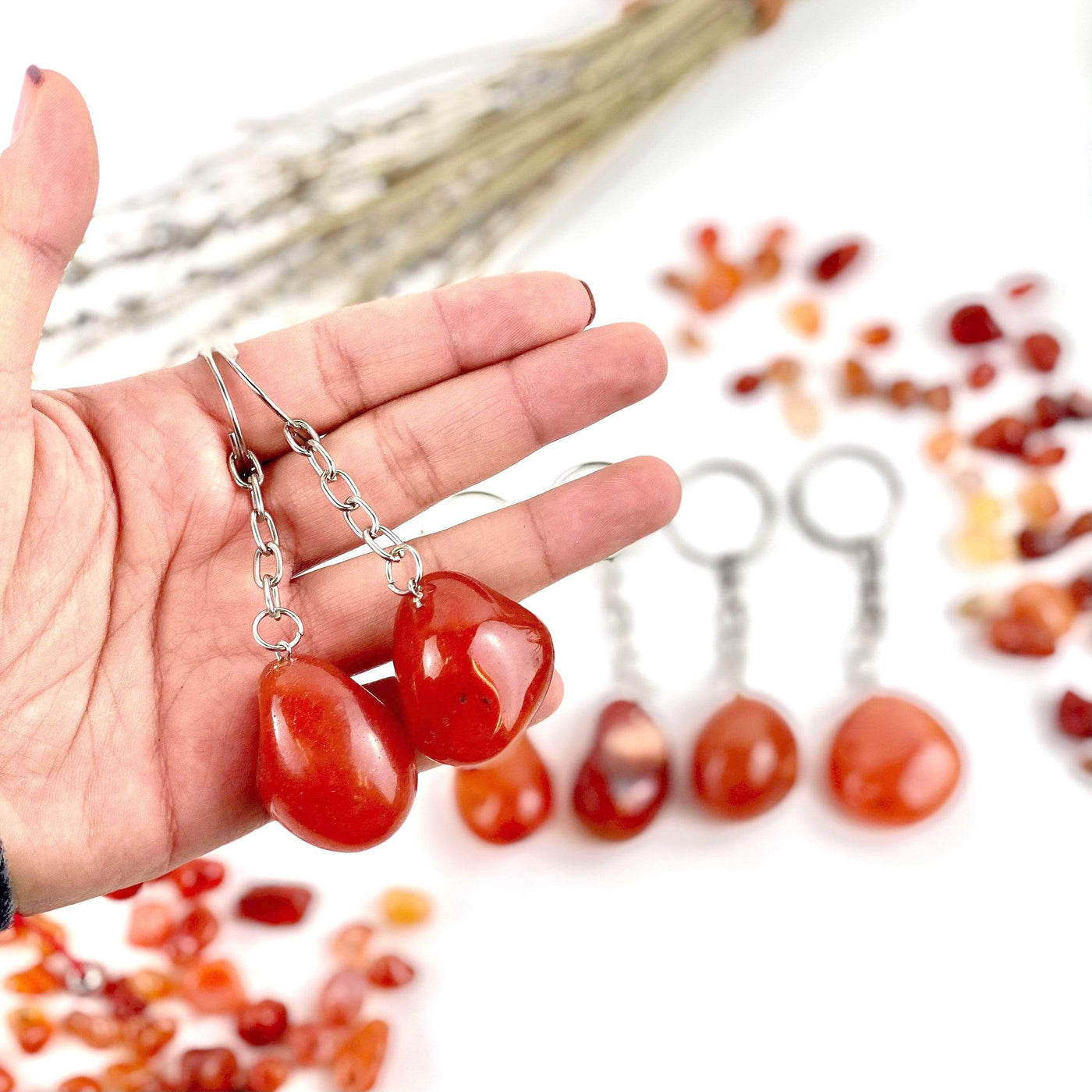 2 carnelian keychains in a hand