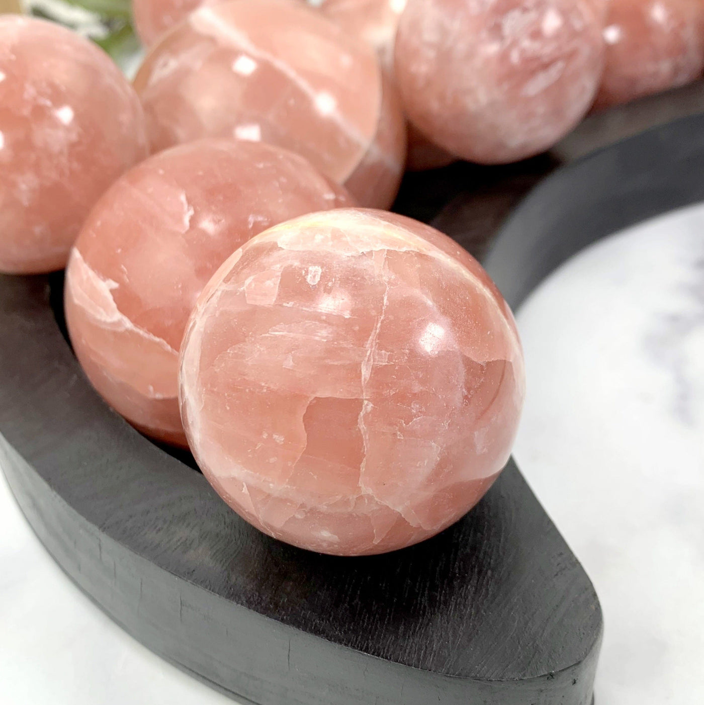 close up of a single rose calcite sphere