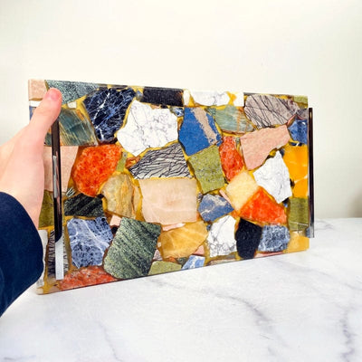 mosaic multi-stone platter propped up in hand for size reference