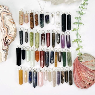 multiple gemstone pendants with circle silver bail displayed showing the different stone options available