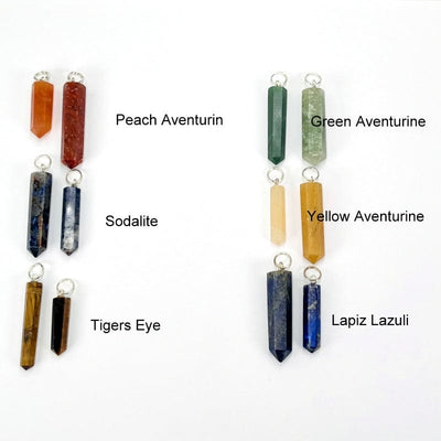close up of the peach aventurine, sodalite, tigers eye, green aventurine, yellow aventurine and lapis lazuli gemstone pendants with silver bail