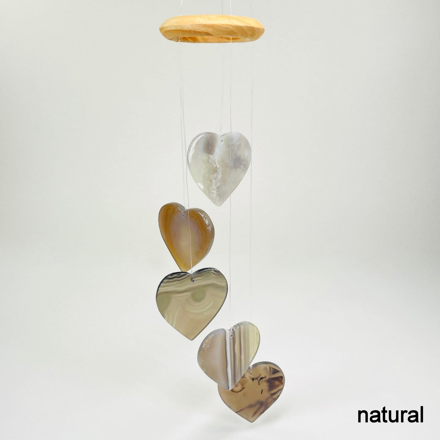 one natural agate heart wind chime hanging in front of white background