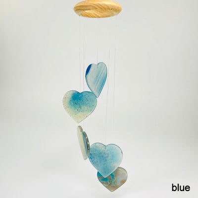 one blue agate heart wind chime hanging in front of white background