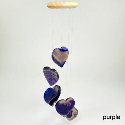 one purple agate heart wind chime hanging in front of white background