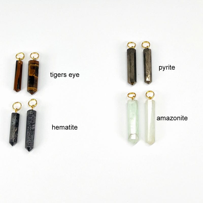 close up of tigers eye, hematite, pyrite and amazonite gemstone pencil point pendants with circle gold toned bail 