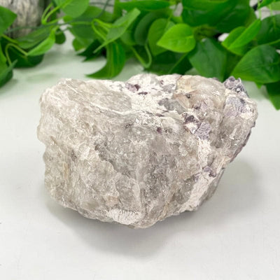 showing different side and top view of purple lepidolite with flashes of mica cluster