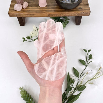 rose quartz hamsa hand in hand for size reference