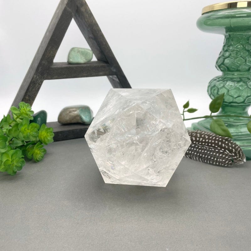 crystal quartz hexagon in front of backdrop