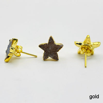 three gold natural druzy star stud earrings on white background for side, front, and back view