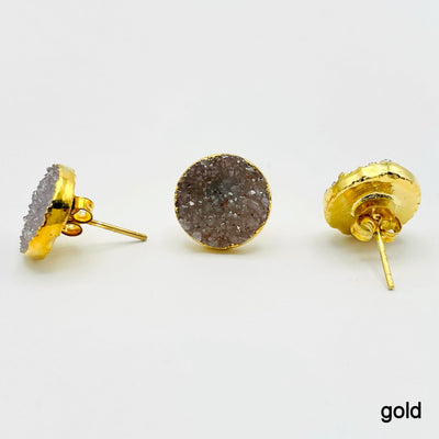 three gold natural druzy round stud earrings on white background for side, front, and back view