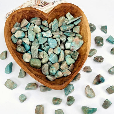 one pound of amazonite tumbled stones displayed to show the differences in the stone sizes 