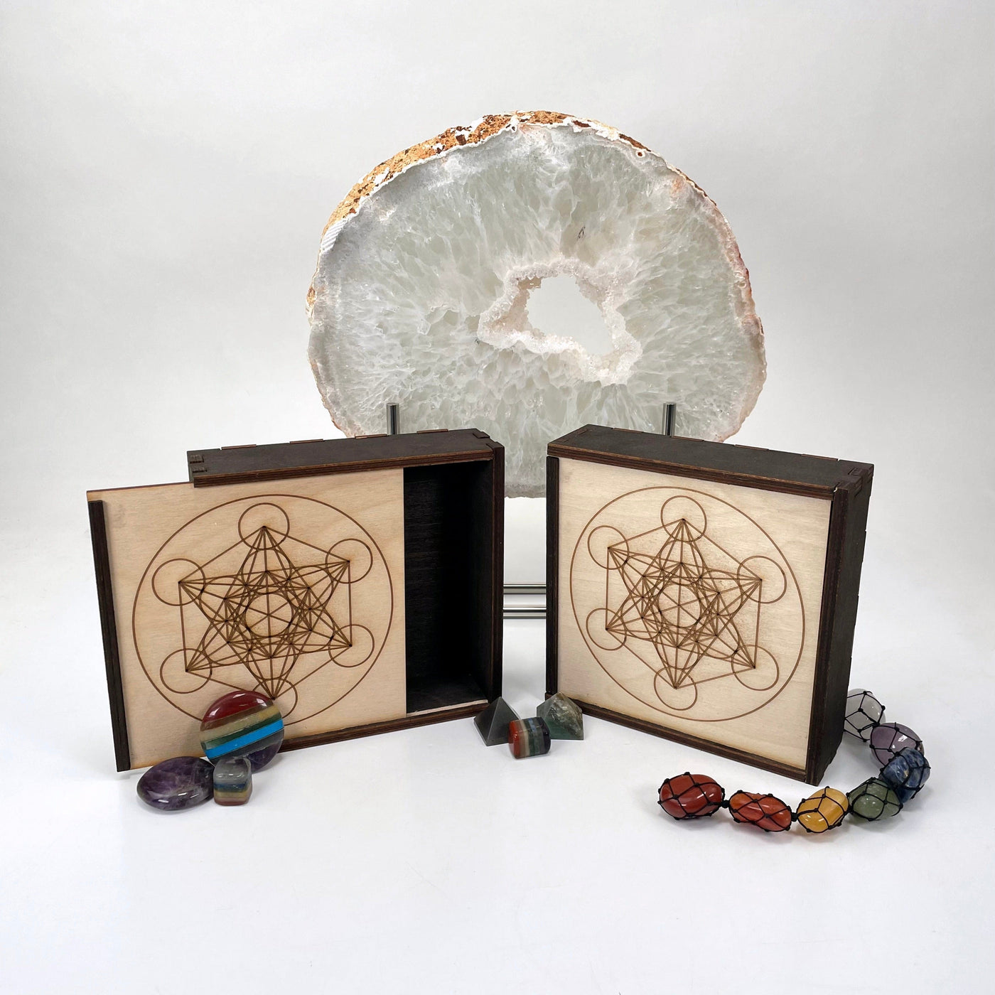 metatron's cube wooden storage box propped up in front of backdrop 
