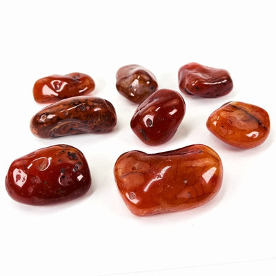side view of the carnelian tumbled stones to show the thickness 