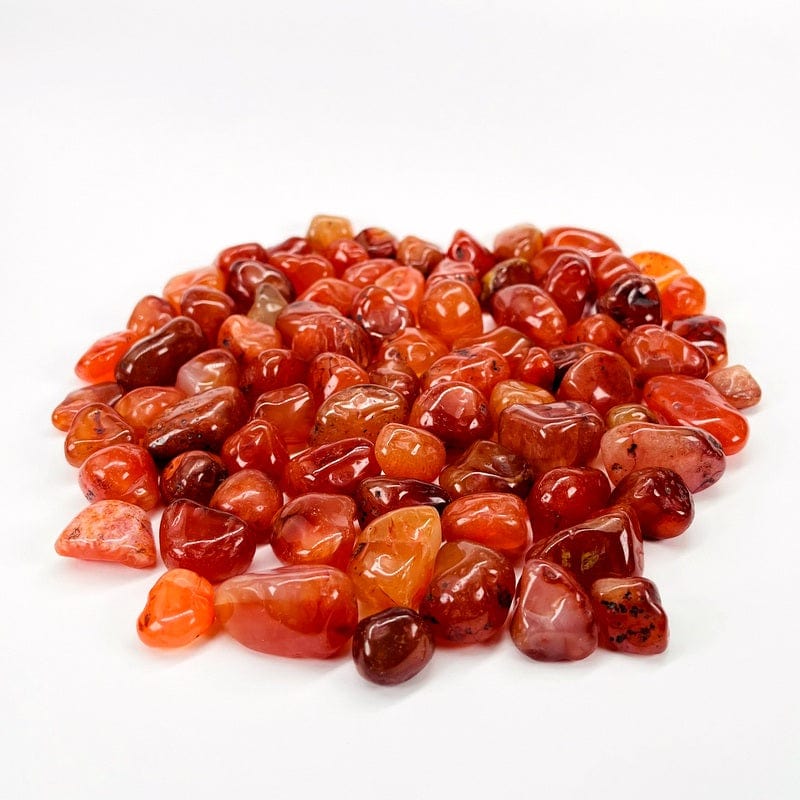Assorted carnelian stones on a white background.