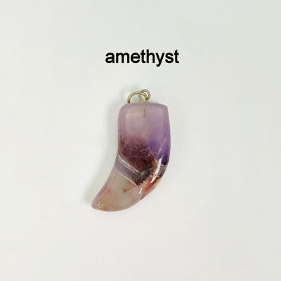 close up of one tumbled amethyst horn pendant on white background for details