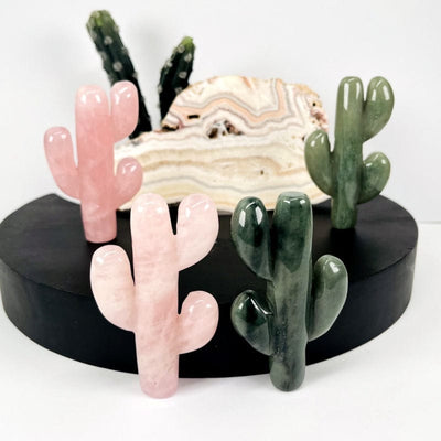 rose quartz and green aventurine cactus shaped crystals displayed as home decor