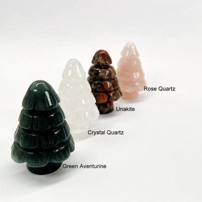 gemstone trees next to their stone names. available in rose quartz, unakite, crystal quartz, and green aventurine 