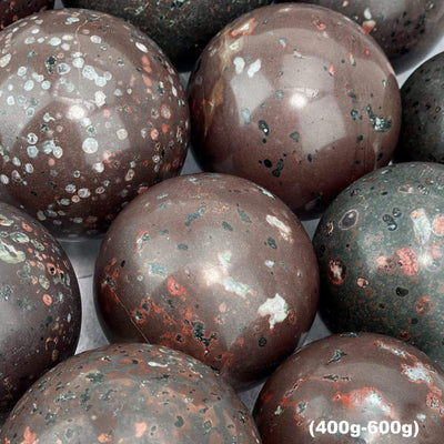 up close shot of 400-600g plum blossom jasper stone spheres