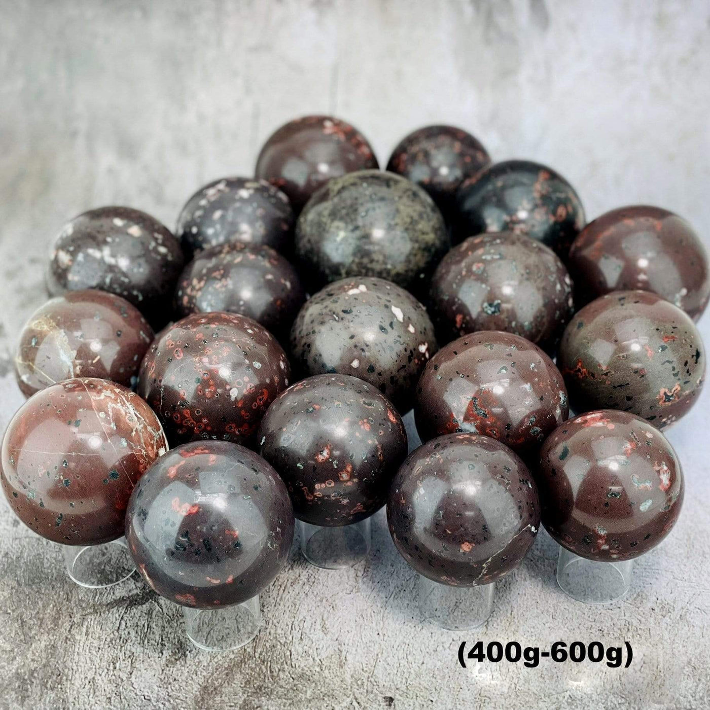 400-600g plum blossom jasper stone spheres on gray background