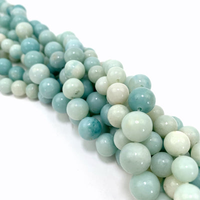both variations of amazonite twisted together on a white background