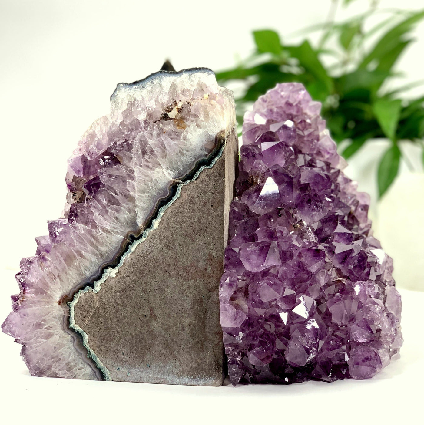 Photo of amethyst cluster cut base book end, the first half of the book end is being photographed side ways while the other one is forward facing. 