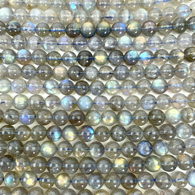 Labradorite beads laid out to show the different varieties of beads