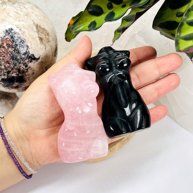 gemstone goddess body carved stone in hand for size reference  